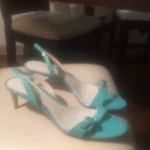 Turquoise pants and leather sandals